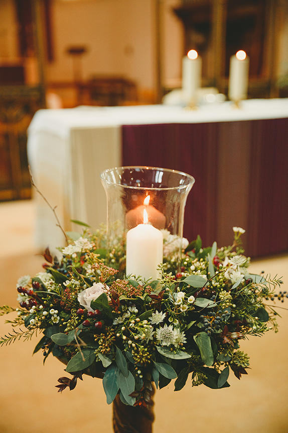 Winter Wedding Bride Wears Vintage Inspired Dress festive-plant-wedding-church-decorations