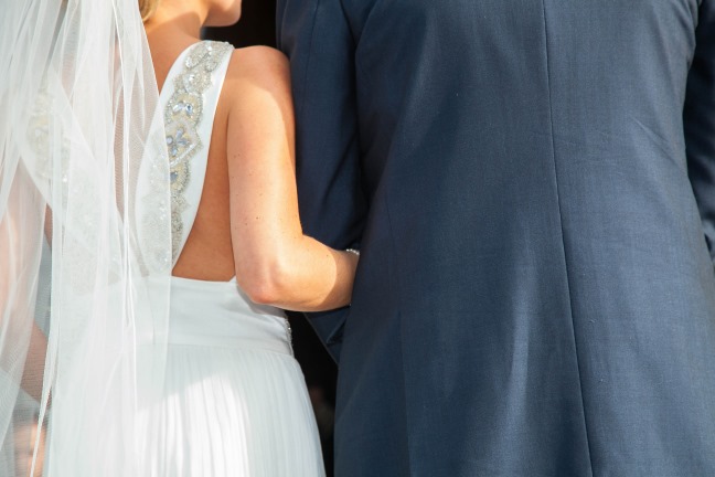 Bride Wears Simple Wedding Dress To Romantic Seaside Nuptials In Ireland sanyukta_shrestha-backless-wedding-gown