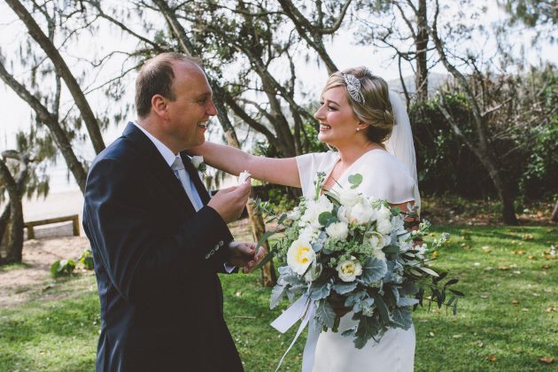 Sleek Bespoke Silk Dress For A Destination Beach Wedding groom tears first look bride