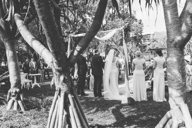 Sleek Bespoke Silk Dress For A Destination Beach Wedding wedding ceremony palm trees